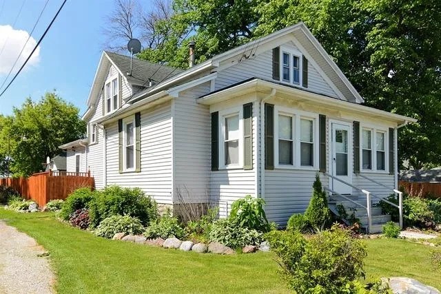 a front view of a house with a yard