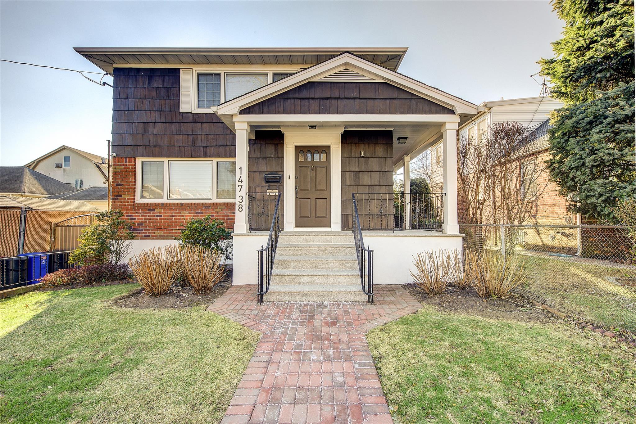 View of front of house with a front yard