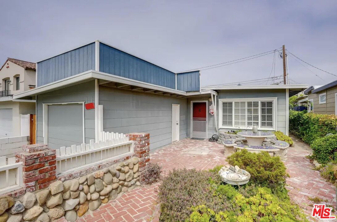 a front view of a house with patio