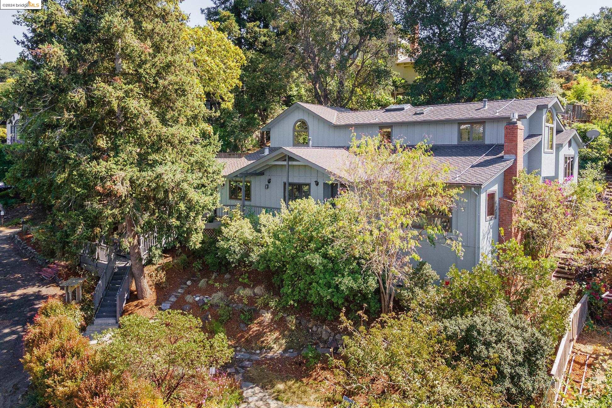 a view of a house with a yard and garden