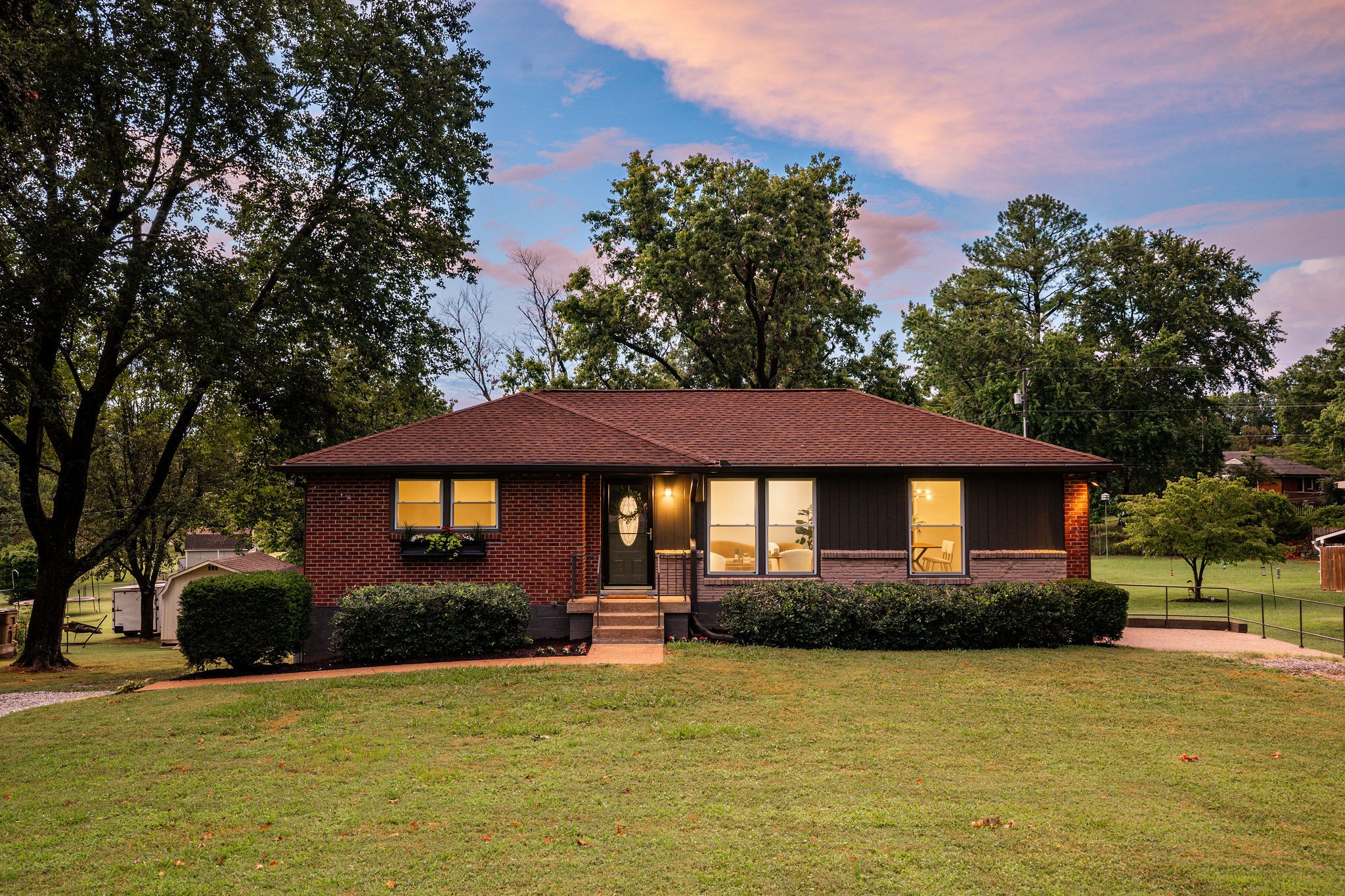 a front view of a house with a yard