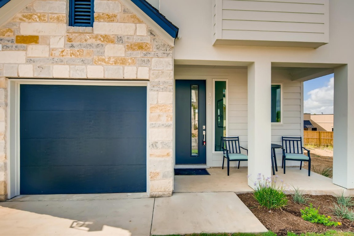 a front view of a house with outdoor seating