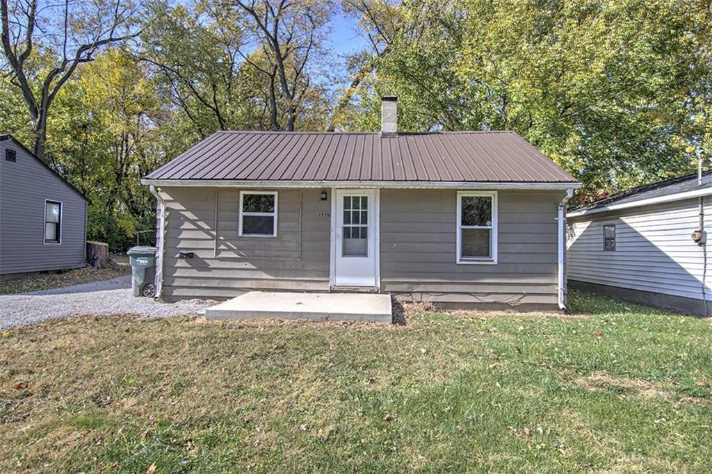 a backyard of a house with wooden floor and fence