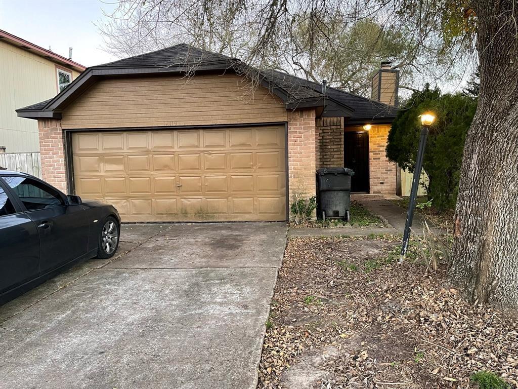 a backyard of a house with barbeque oven