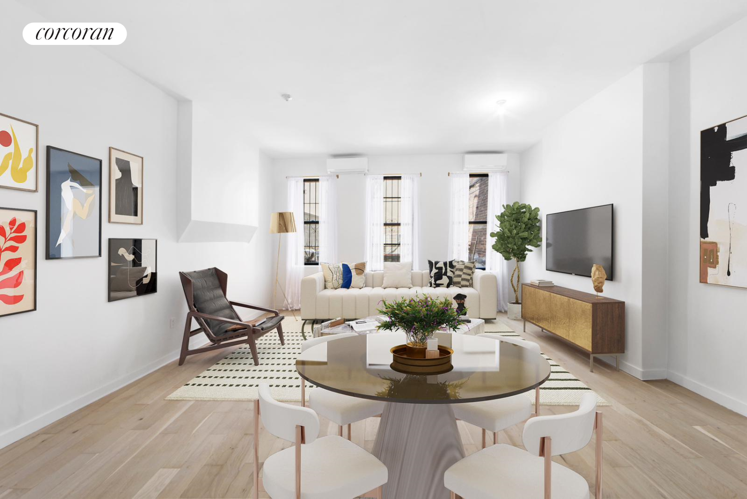 a living room with furniture and a dining table with wooden floor