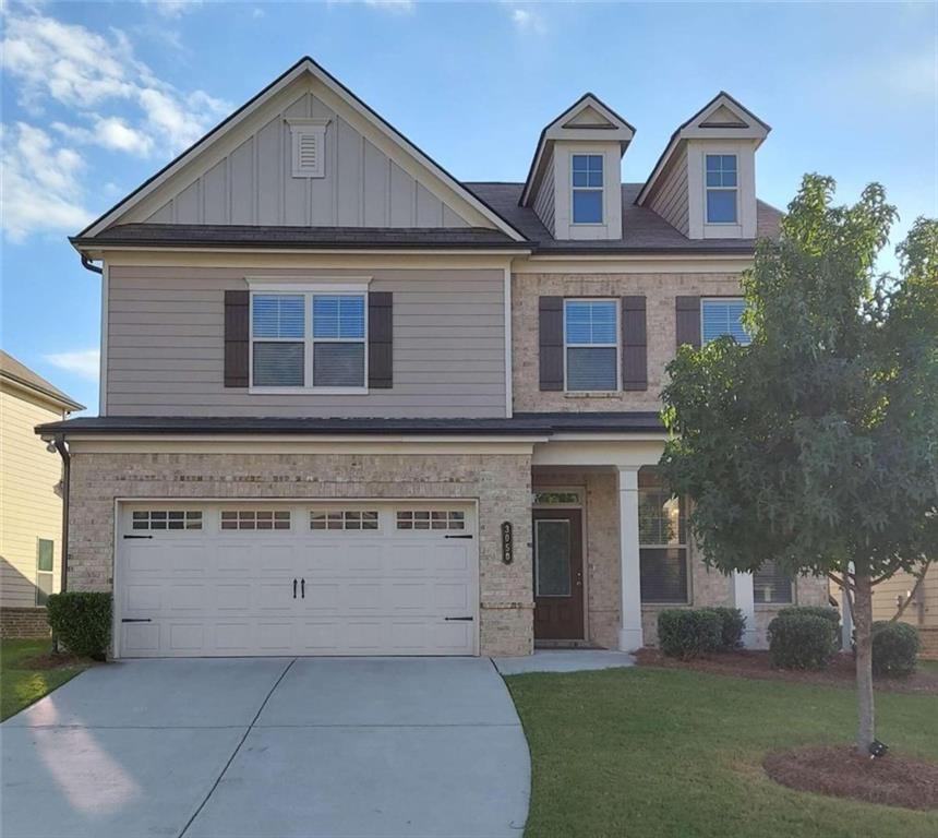 front view of a house with a yard