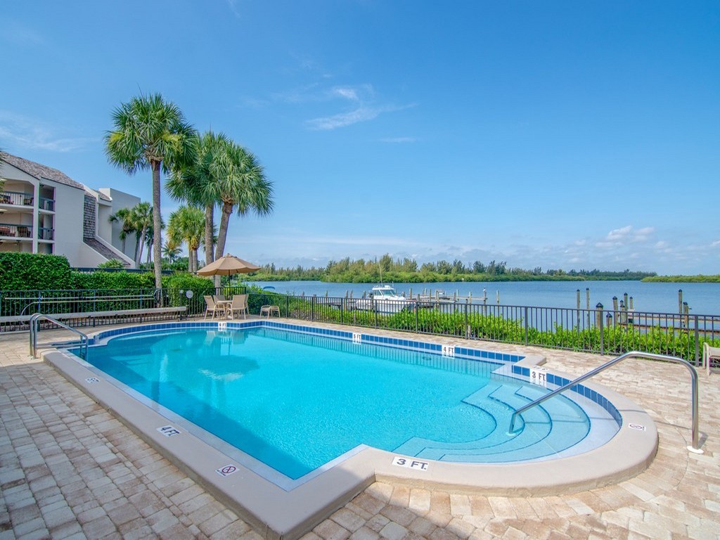 a view of a swimming pool with a patio