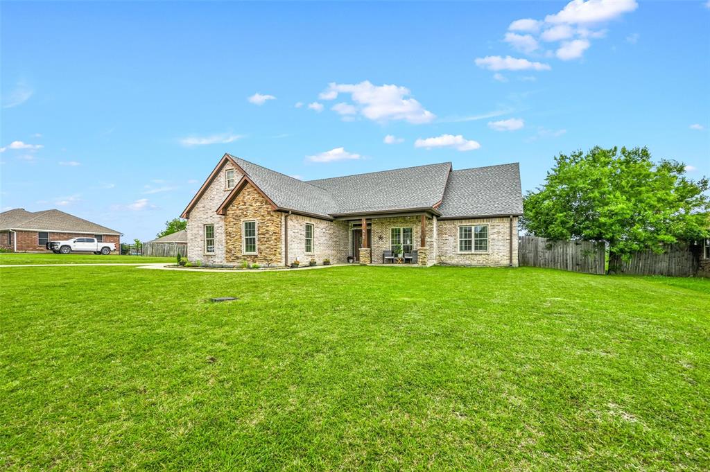 a view of a house with a big yard