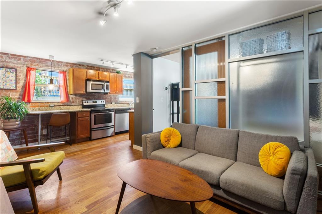 a living room with furniture and a flat screen tv