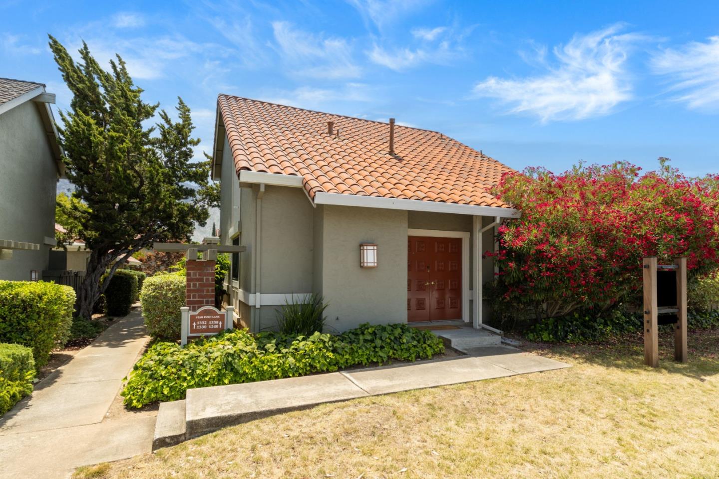 a front view of a house with a yard