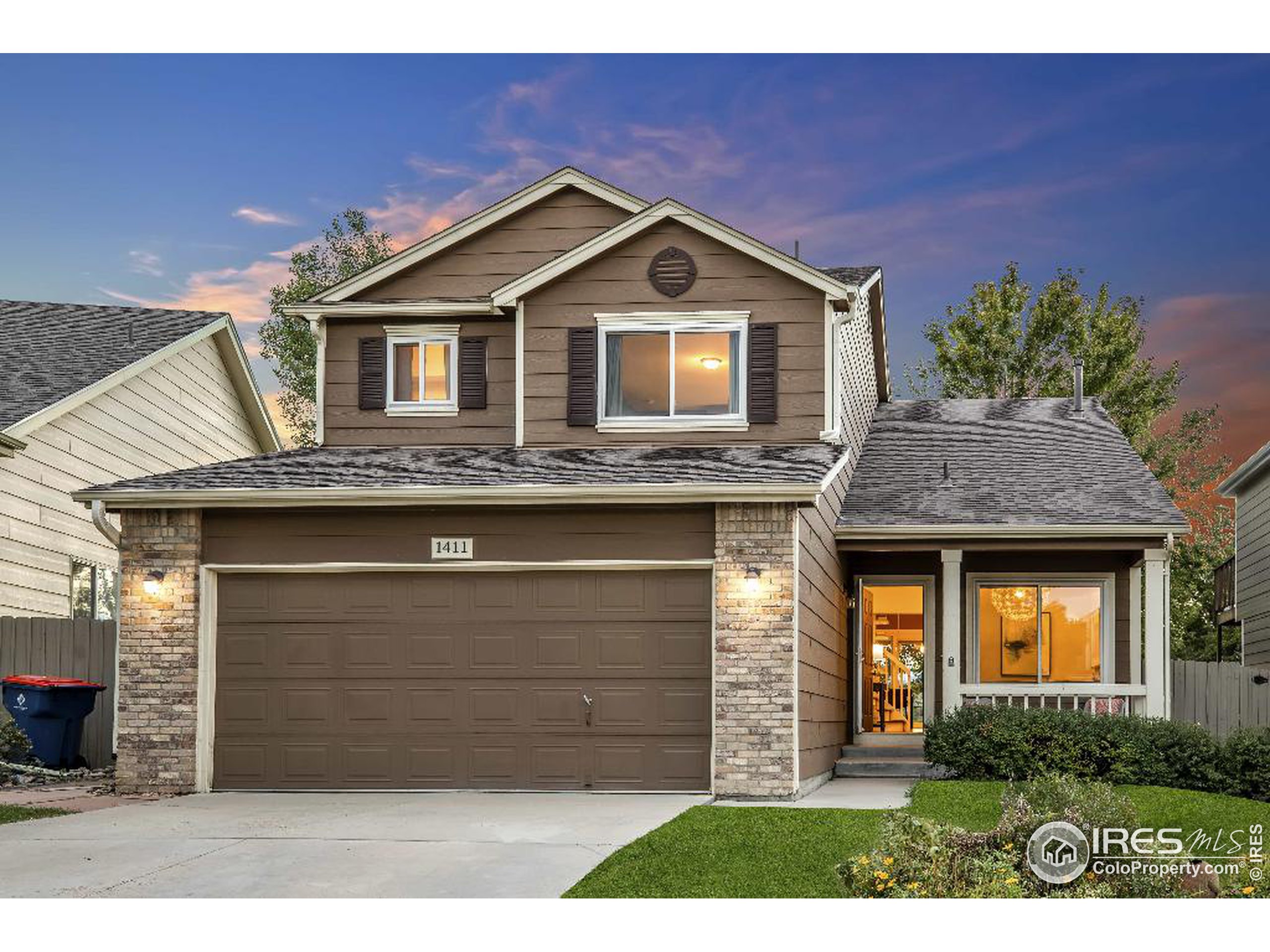 a front view of a house with a garage