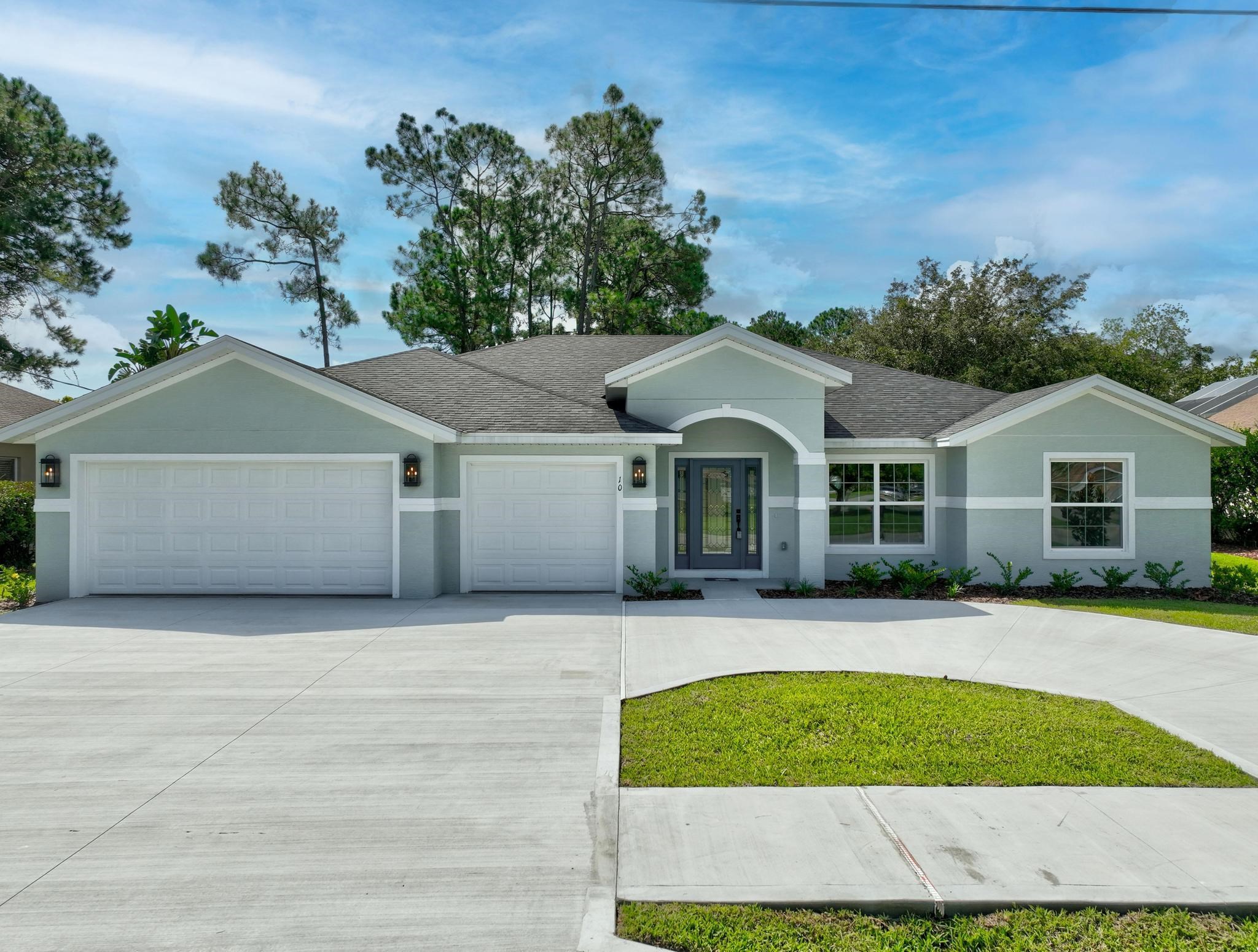 a front view of a house with yard