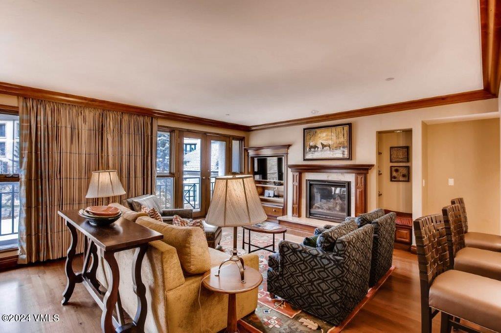 a living room with fireplace furniture and a window