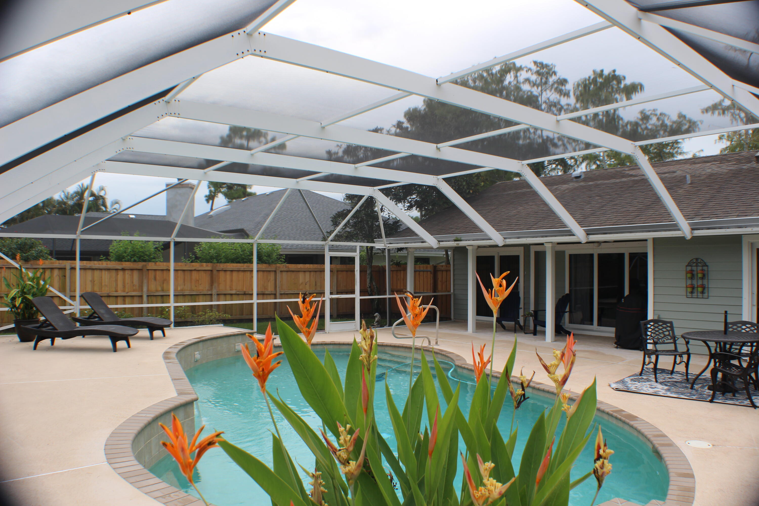 a view of a swimming pool with a patio