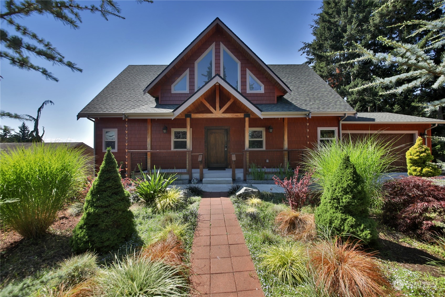 a front view of a house with garden