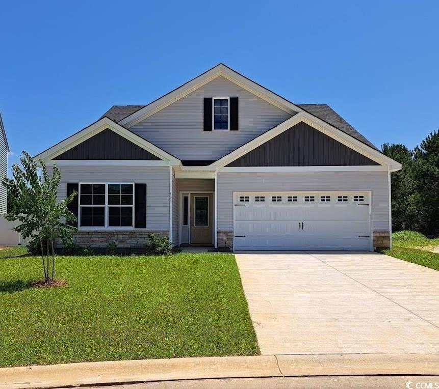 Craftsman-style home featuring a garage and a fron