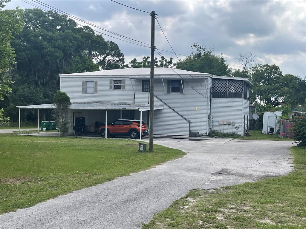 a view of a house with a sink and a yard