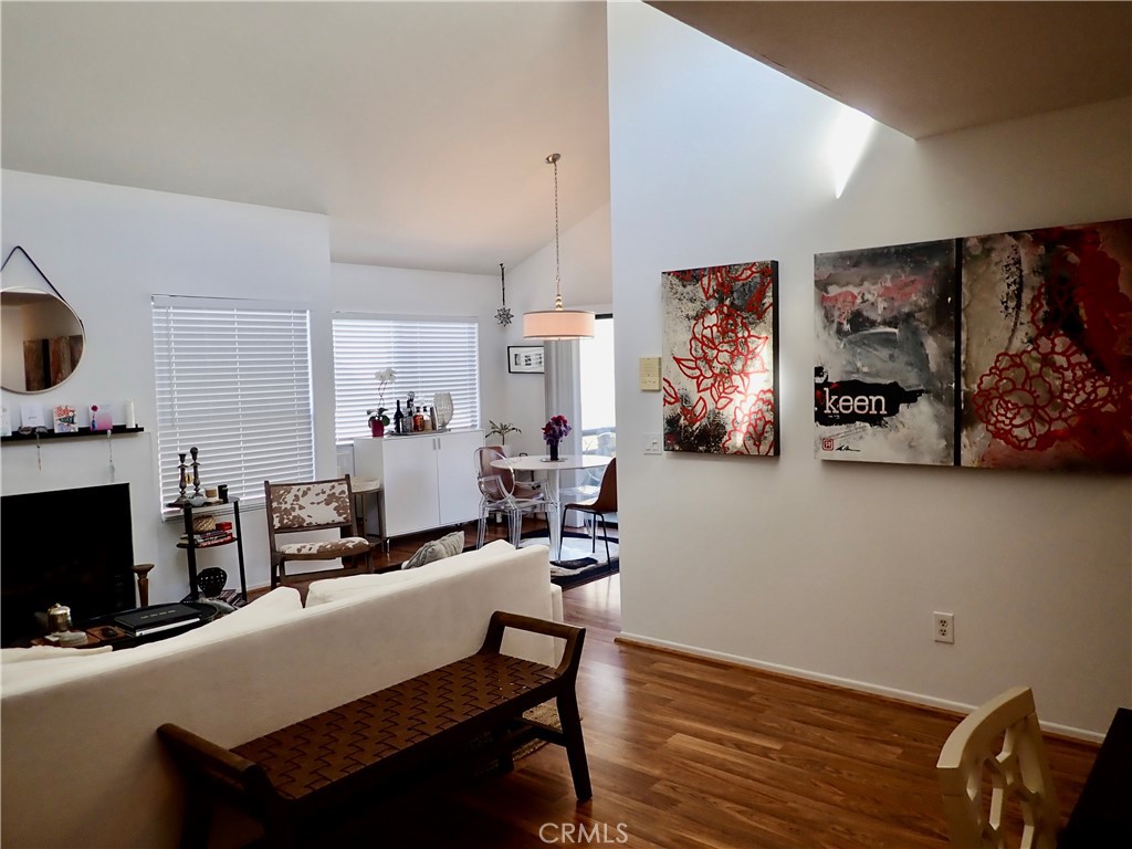 a living room with fireplace furniture and a flat screen tv