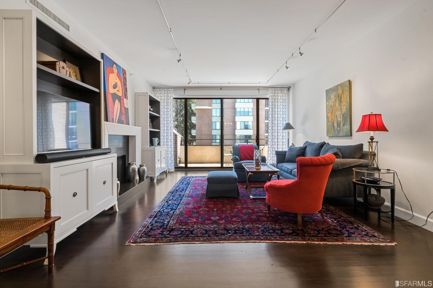 a living room with fireplace furniture and a window