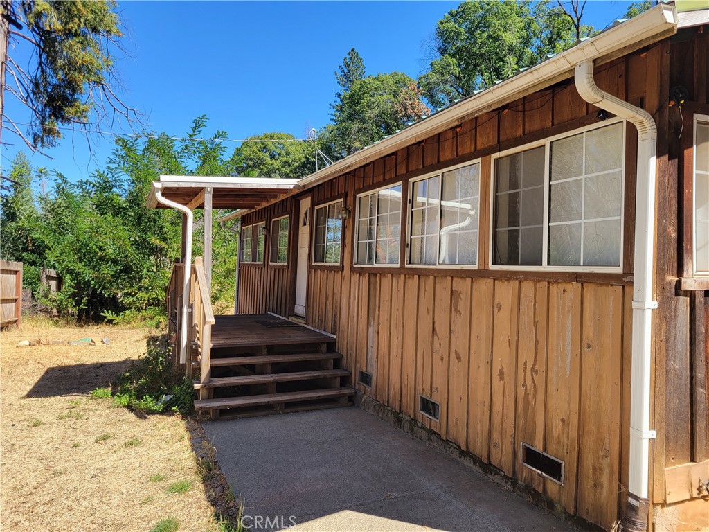 a view of outdoor space with deck and yard