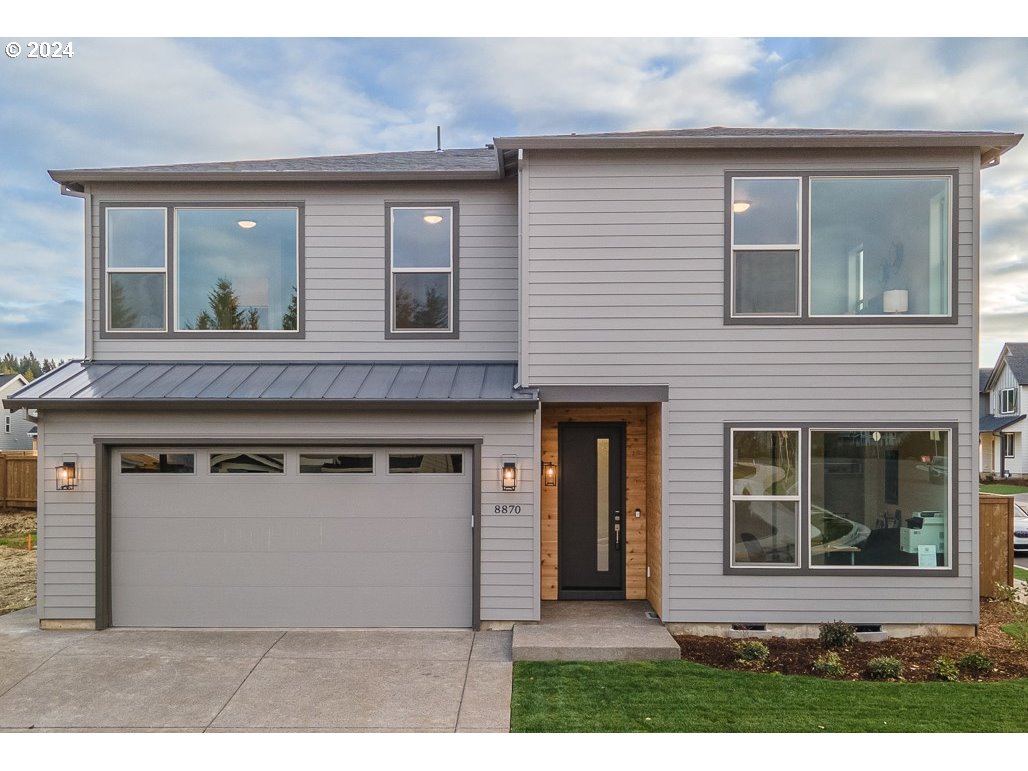 a front view of a house with garage