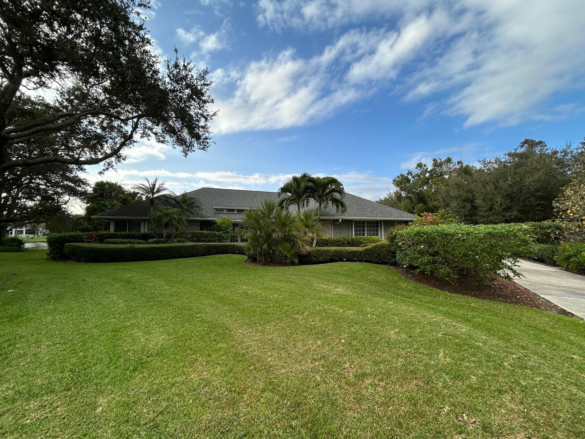 a view of a garden and basketball court