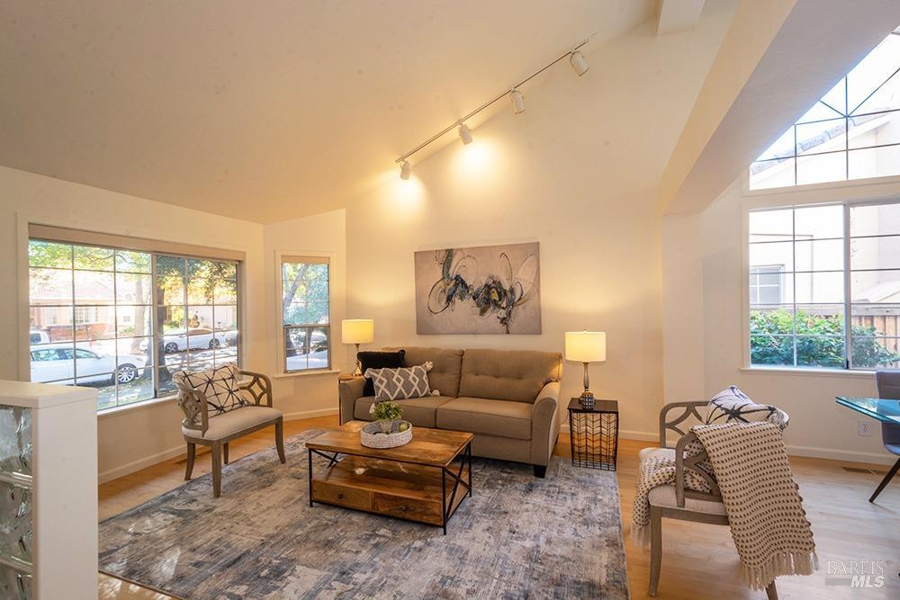 a living room with furniture and a large window