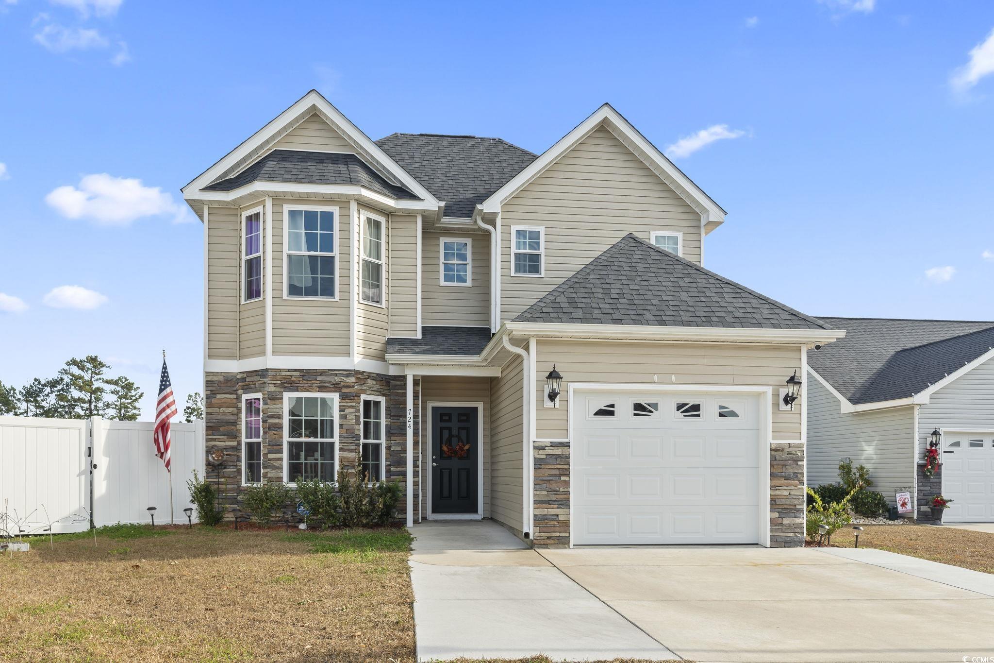 View of front of house with a garage