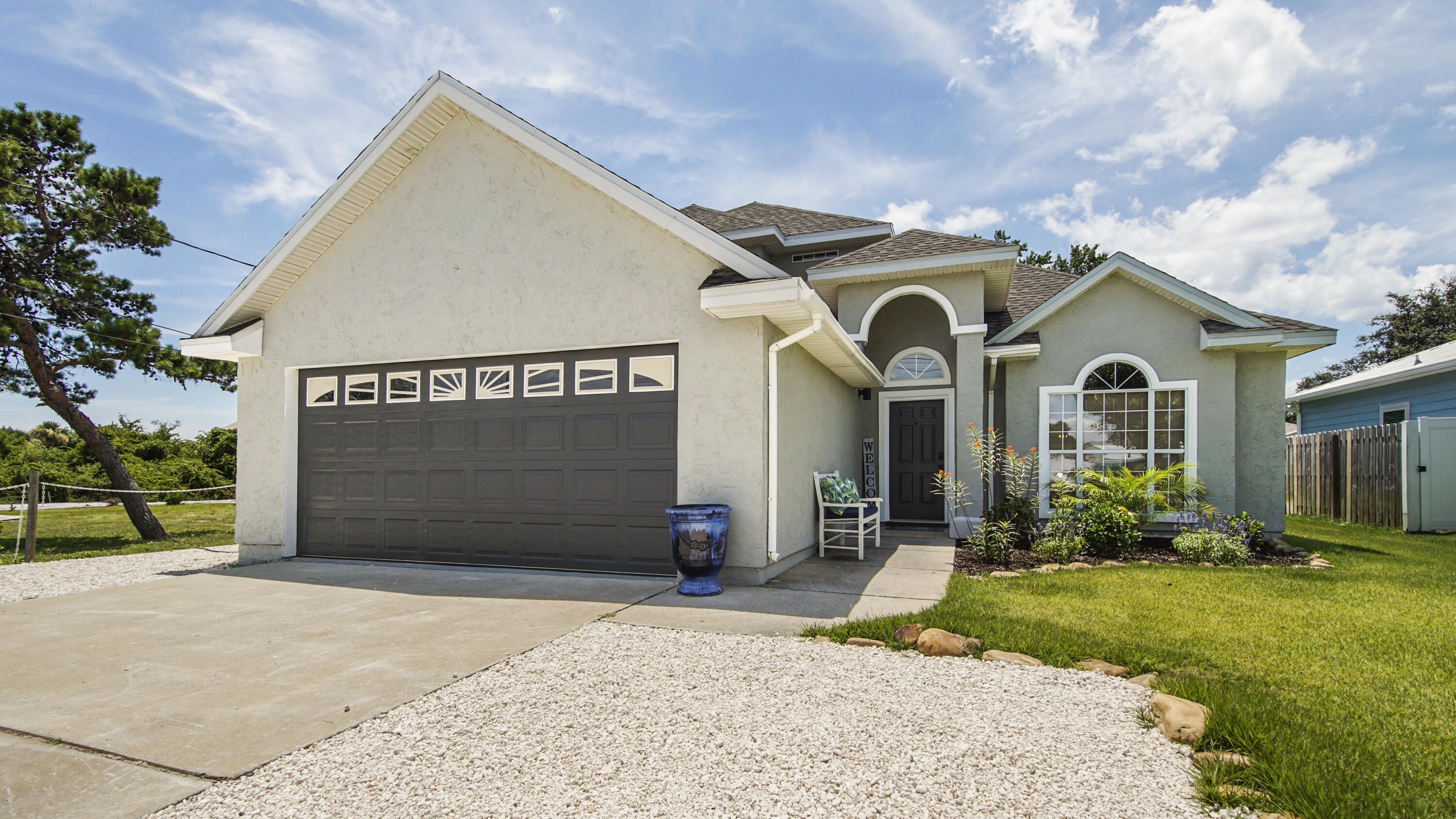 a front view of a house with a yard