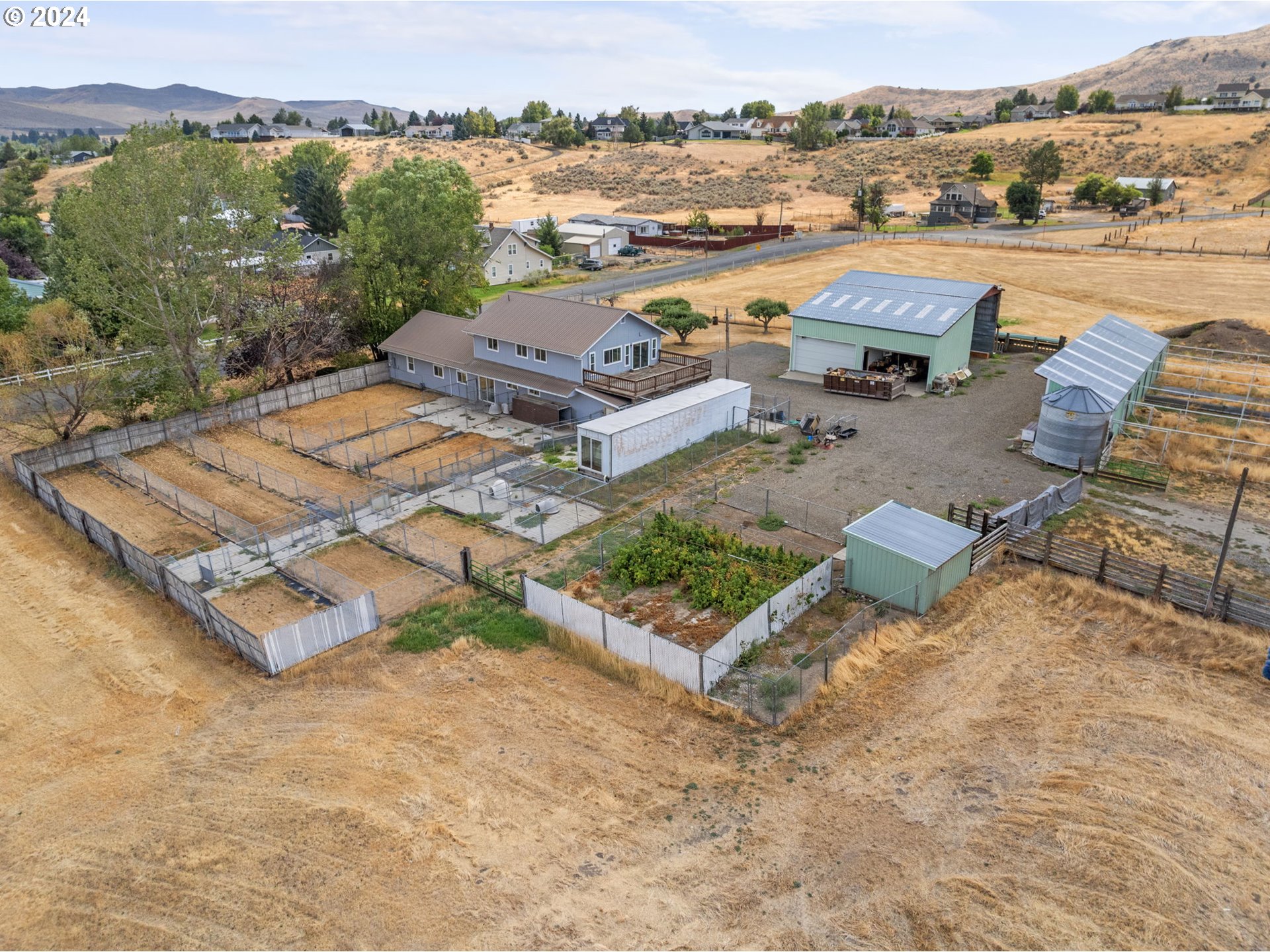 an aerial view of a house with a lake view