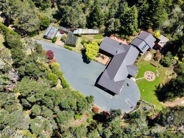 an aerial view of residential house with swimming pool