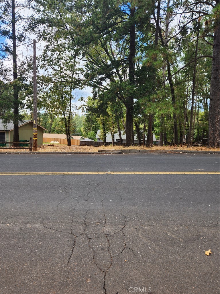 a view of a road with a houses