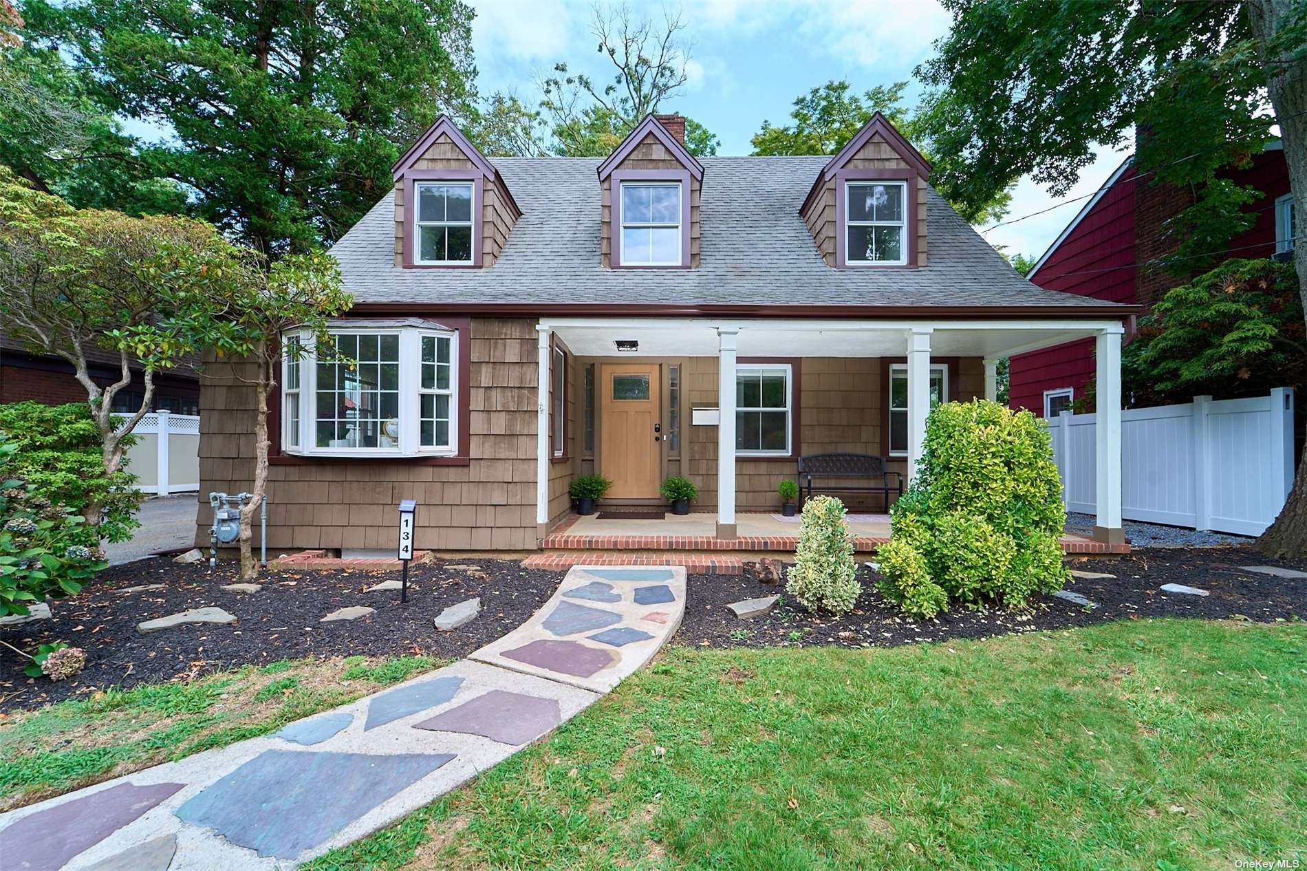 front view of a house with a yard