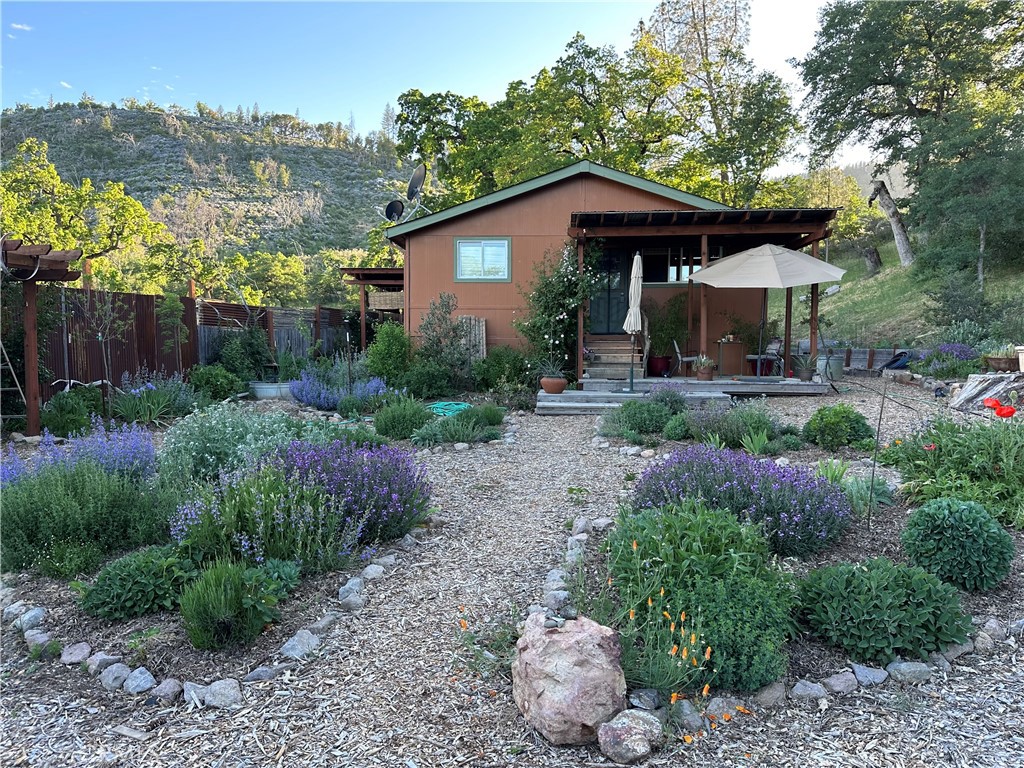 a front view of a house with garden