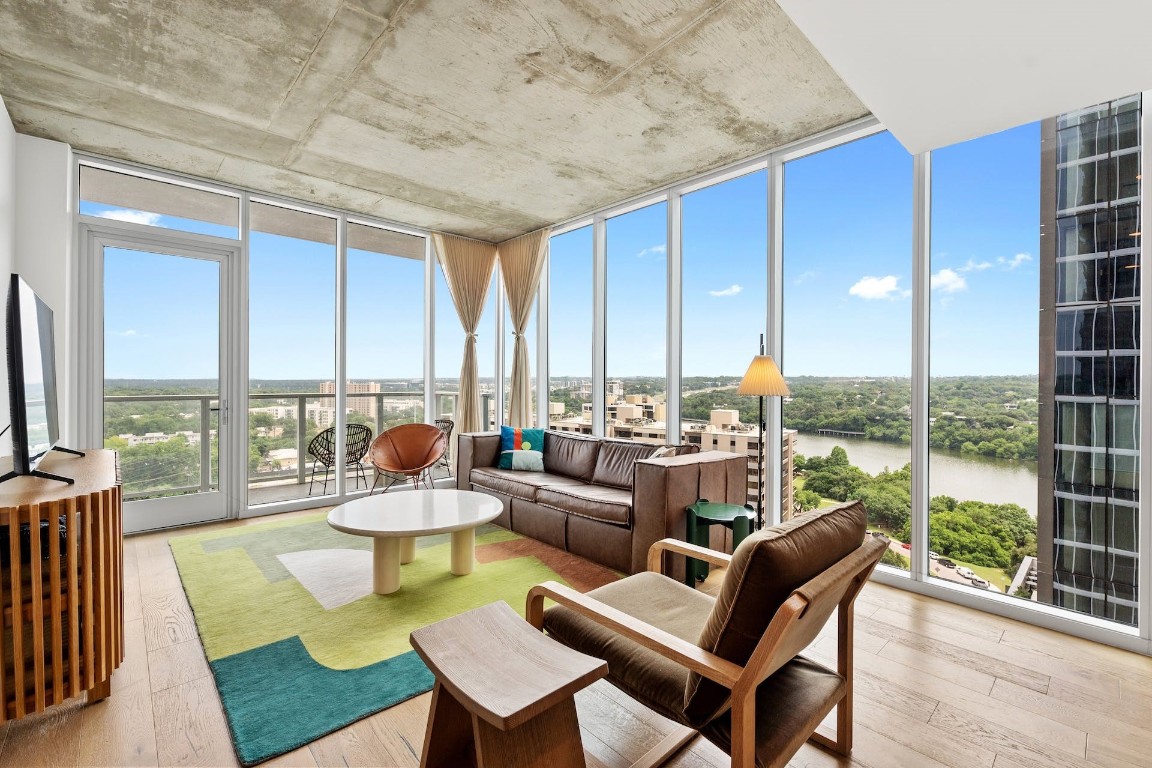 a living room with furniture and a large window