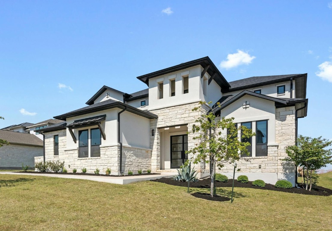 a front view of a house with a yard