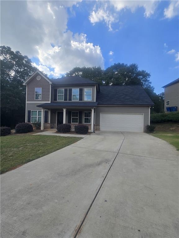 front view of a house with a yard