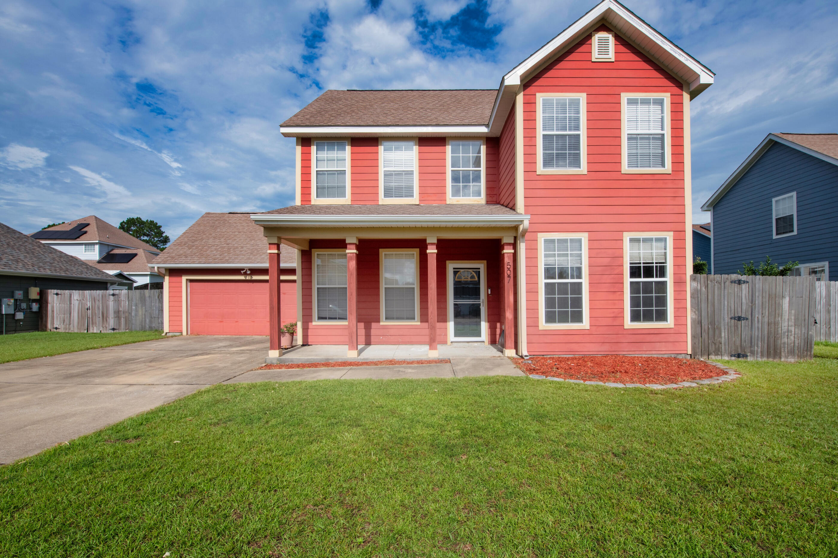 front view of a house with a yard