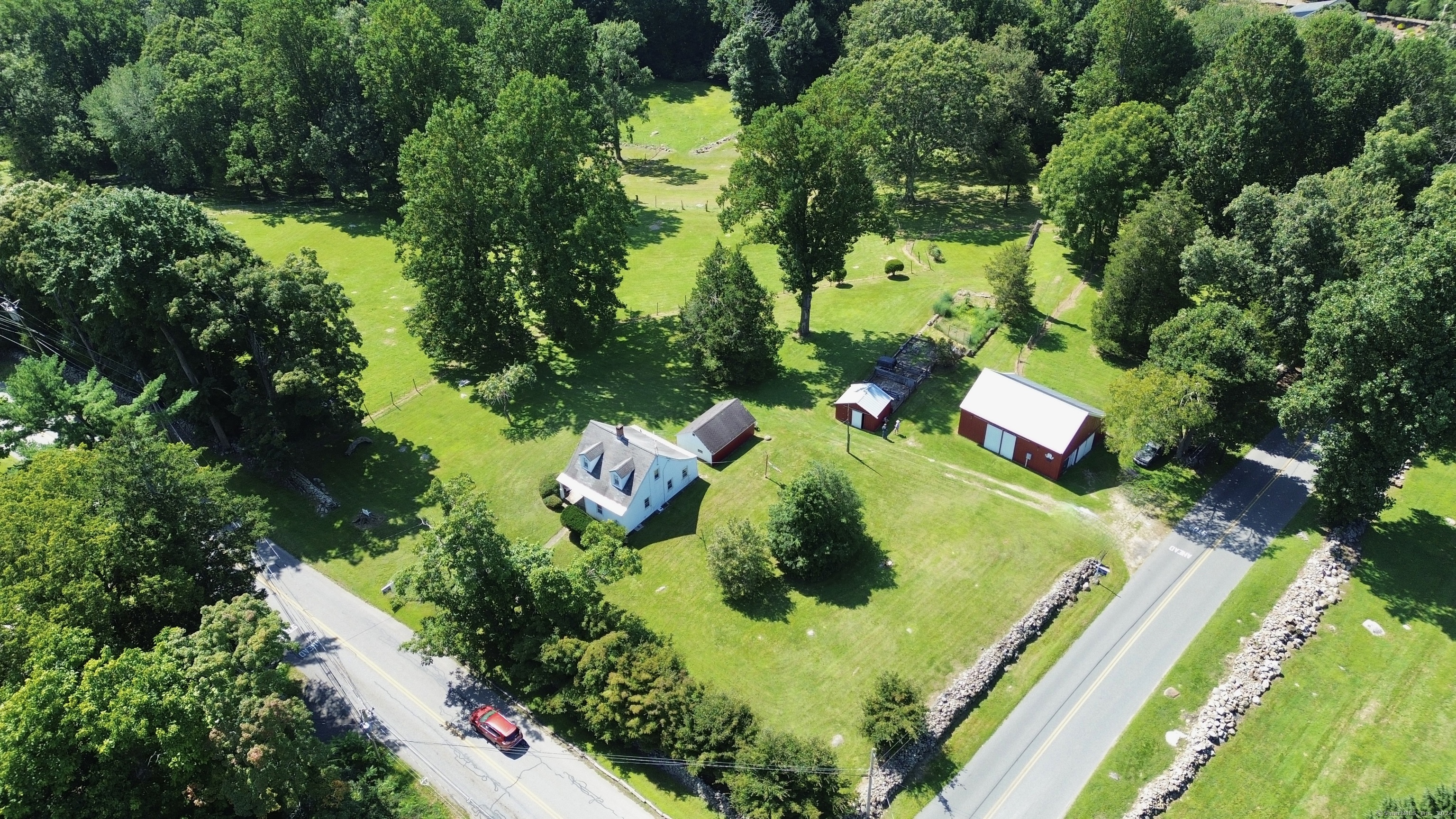 an aerial view of residential house with outdoor space