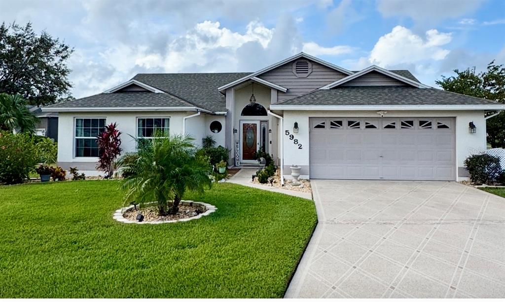 Front of the home, beautifully landscaped with a hidden front patio.