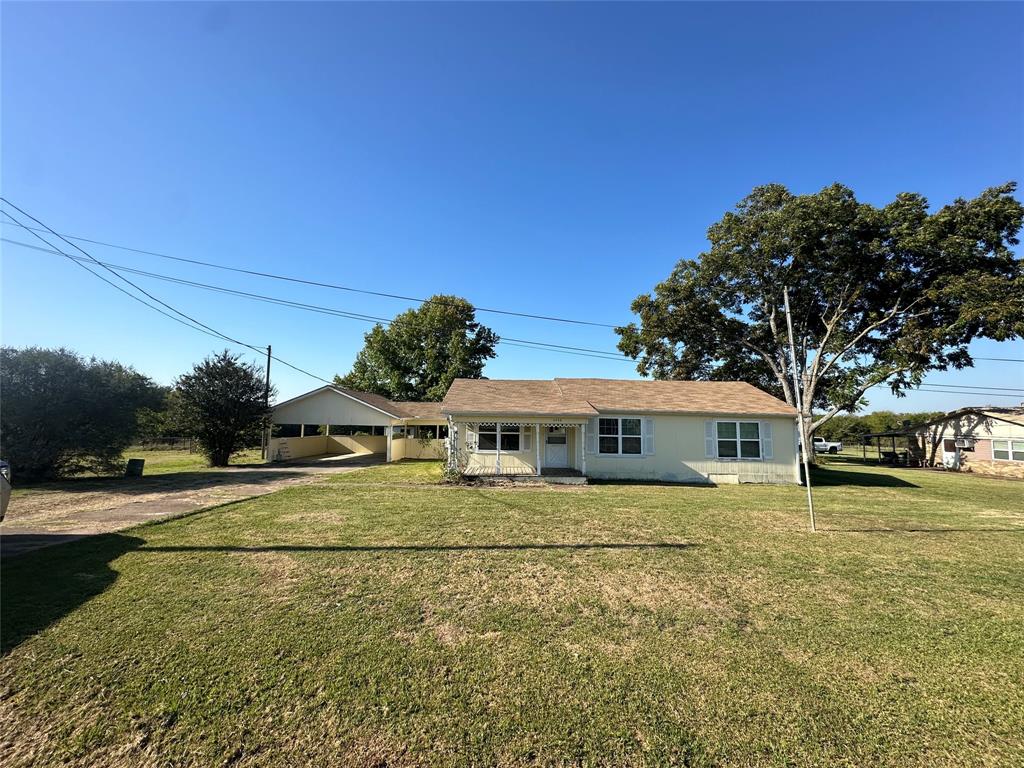 a view of a house with a big yard