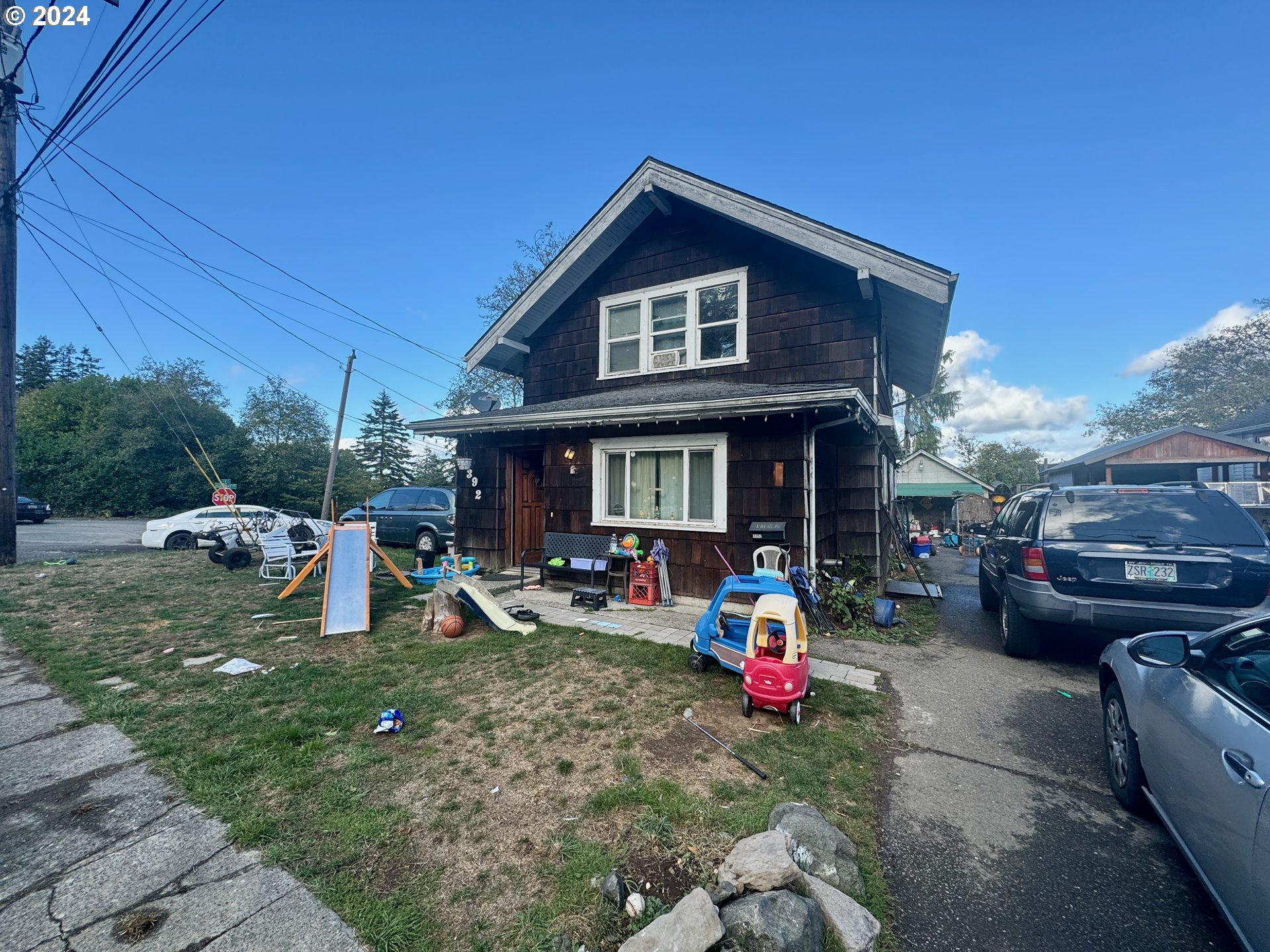 a view of a house with backyard porch and sitting area