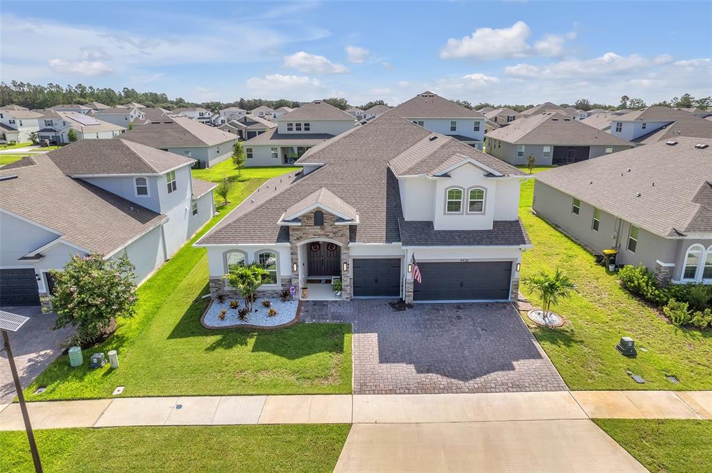 an aerial view of a house with a garden