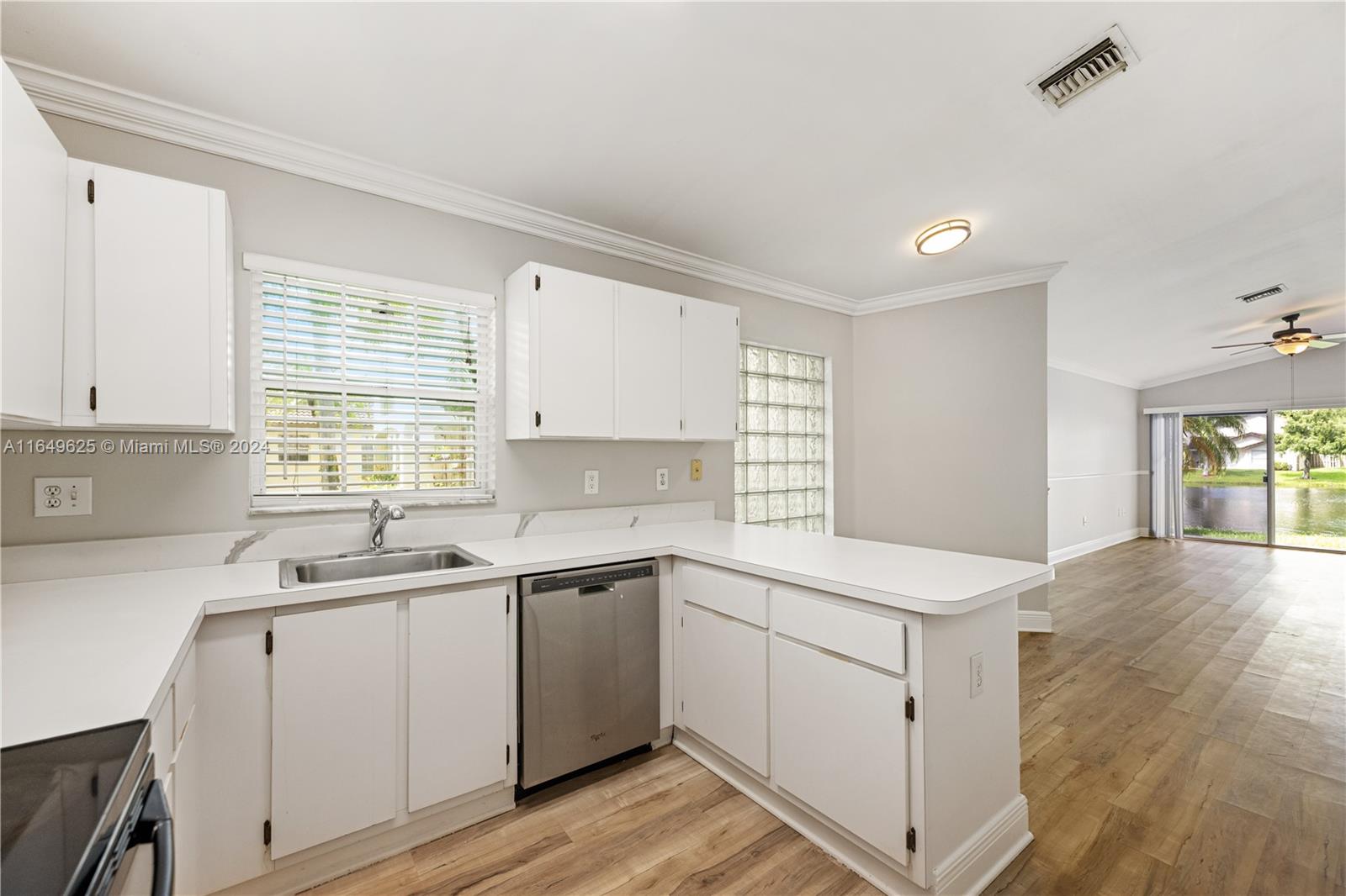 a kitchen with a sink stove and cabinets