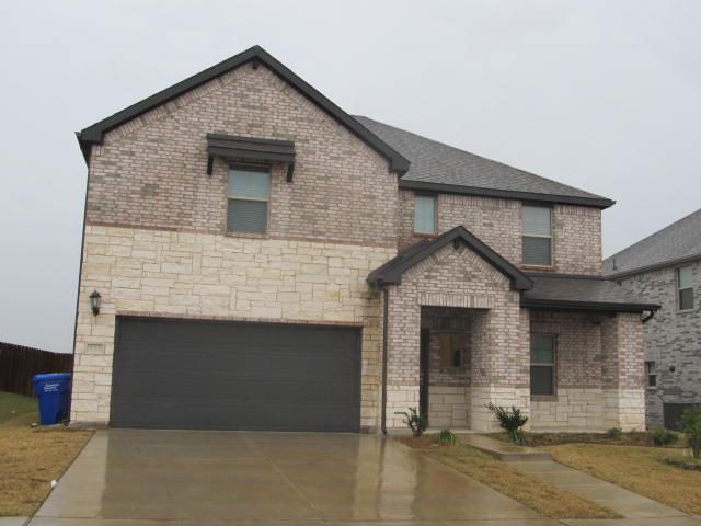 French provincial home featuring a garage