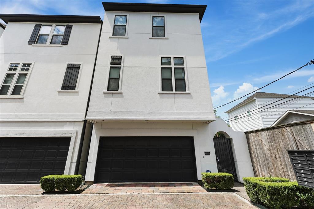 a front view of a house with garage