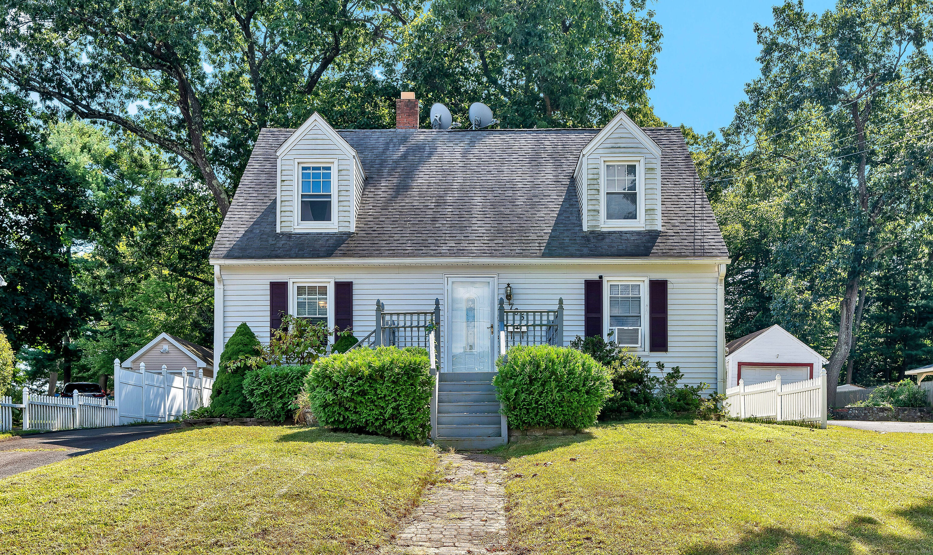 front view of a house with a yard