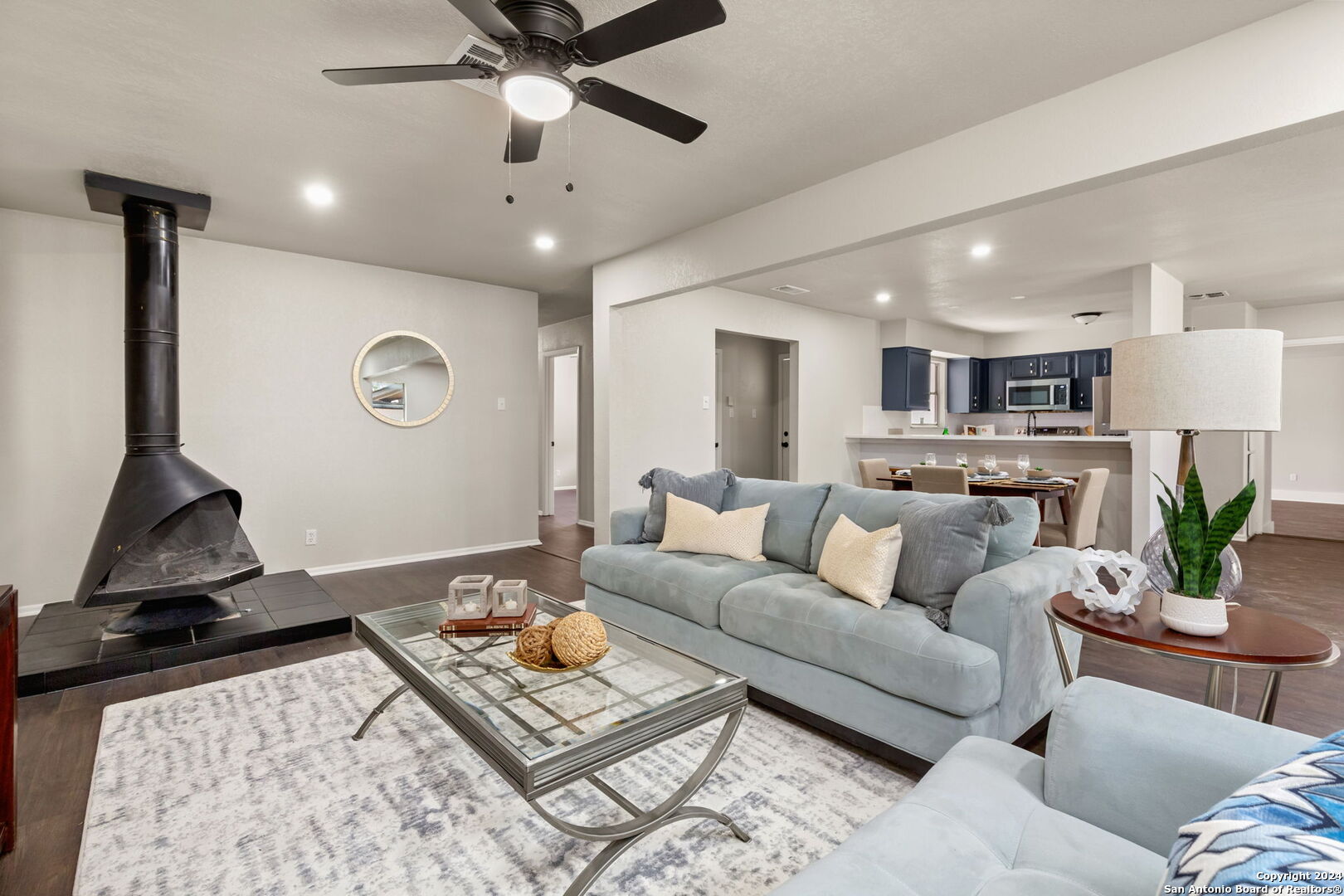 a living room with furniture and a rug