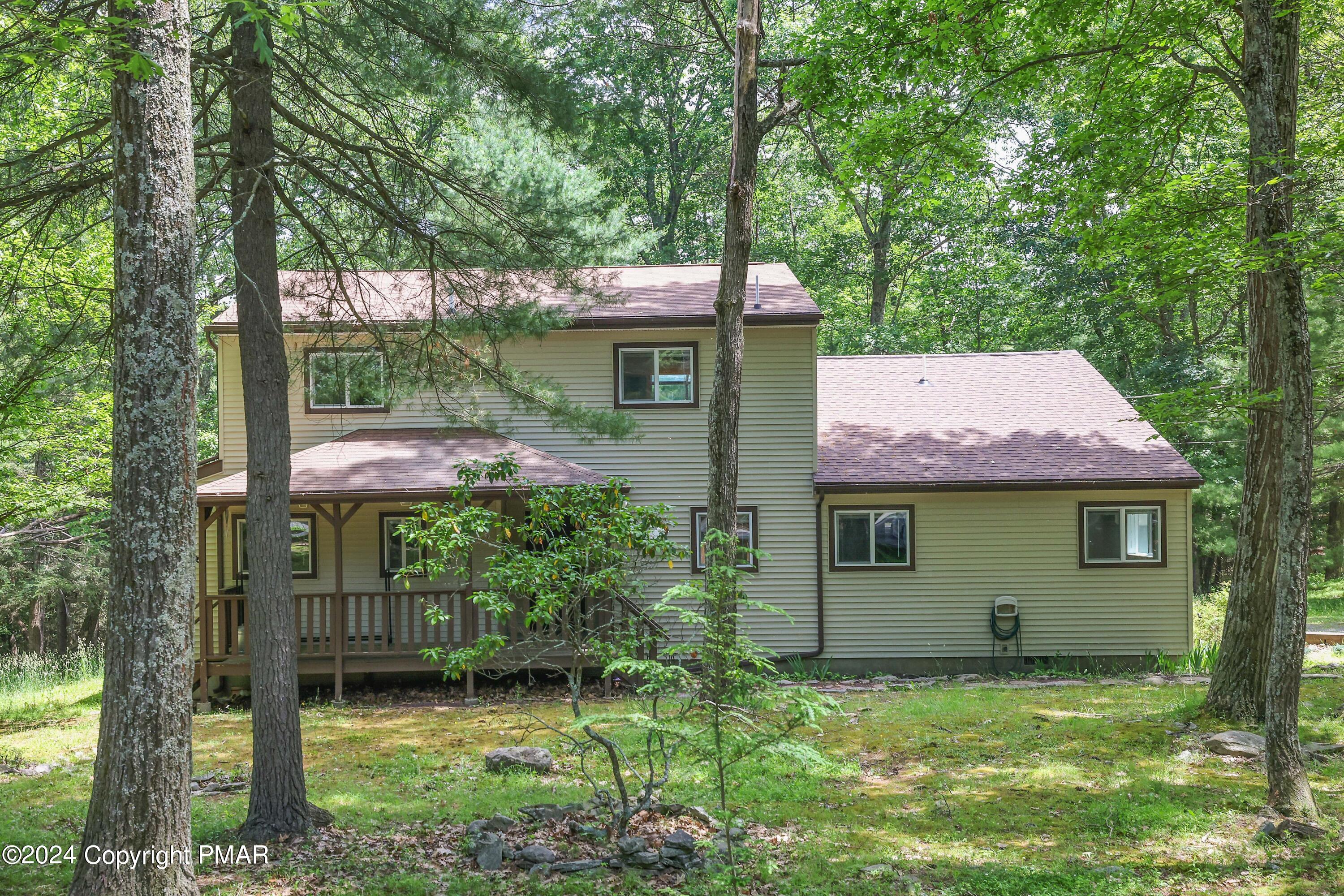 front view of a house with a yard