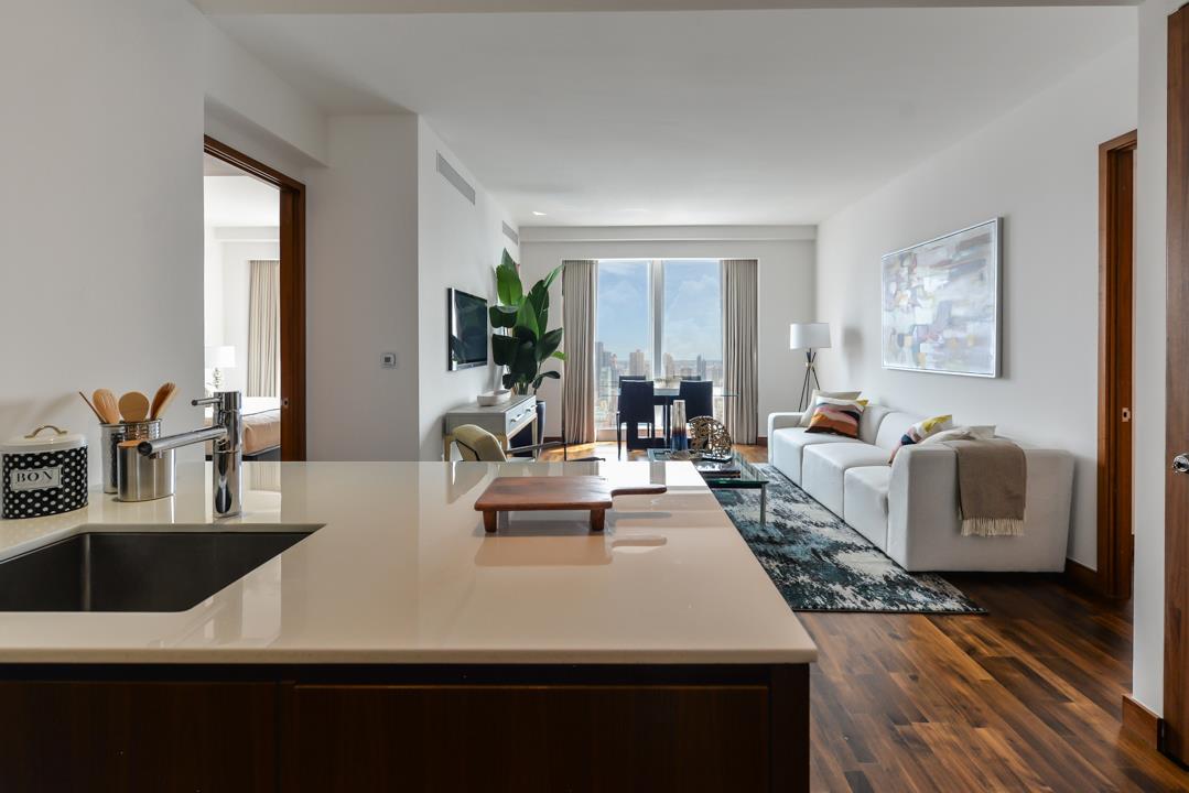 a living room with furniture and a large window